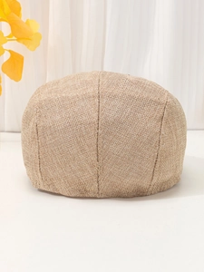 Detailed view of the woven khaki linen texture on a vintage style flat cap for summer