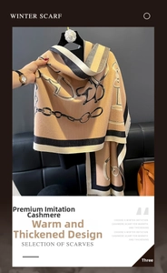 Close-up of thick khaki faux cashmere scarf with vintage chain and horse bit print pattern