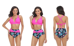 Detail of rose pink halter top and high-waisted tropical floral bikini with cross-straps