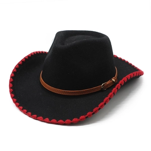 Black felt cowboy hat with red stitching, brown leather band and metal buckle on white background
