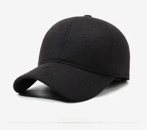 Detail view of winter baseball cap with thick wool texture and silver metal side plate