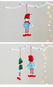 Detail of Christmas elf plush ornaments in red and green on a warm holiday background