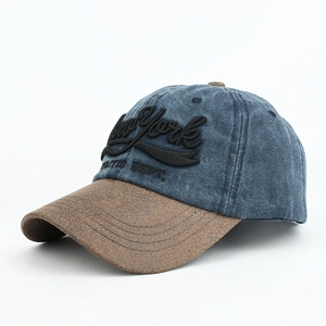 Detail of vintage denim baseball cap with New York 3D embroidery and brown brim