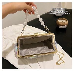 Inside view of sparkly evening bag with beaded handle, gold chain and card slot