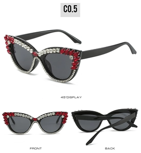 Cat eye sunglasses featuring red and white rhinestone embellishments in multiple views