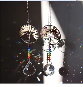 Macro detail of tree of life crystal suncatchers with rainbow light reflections