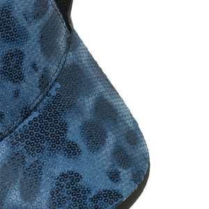 Macro detail of blue leopard print sequins and stitching on baseball cap brim