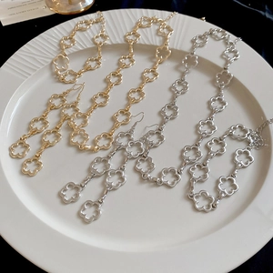 Elegant gold and silver clover jewelry sets featuring tassel necklace and earrings