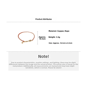 Detail view of woven red rope bracelet with gold-plated charm and dimension specifications