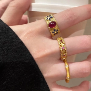 Retro S925 silver bamboo rings with gold enamel and floral inlay on model hand