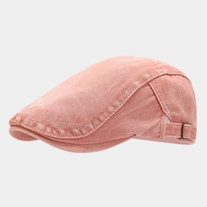 Detail view of pink salmon vintage flat cap with retro copper side adjustment buckle