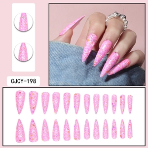 Detailed view of long stiletto press-on nails with vibrant pink glitter sequins