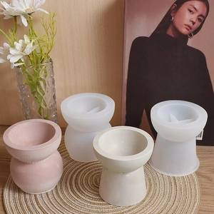 Detailed view of flexible silicone molds and textured geometric gypsum candle holders