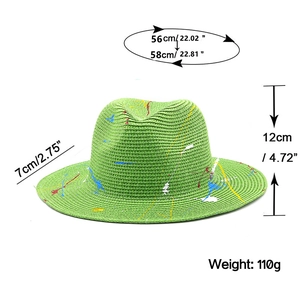 Detailed view of green straw fedora dimensions with artistic paint splatter design