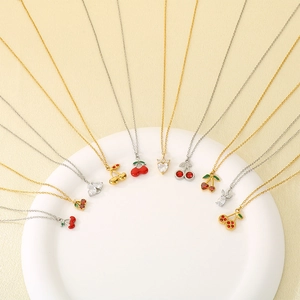 Collection of fruit enamel pendants with cubic zirconia on gold and silver chain necklaces