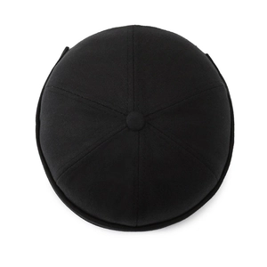 Top view of classic black cotton docker hat with six-panel stitching and top button