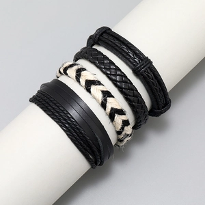 Detail of 4-piece set vintage black leather and beige woven rope bracelets for men