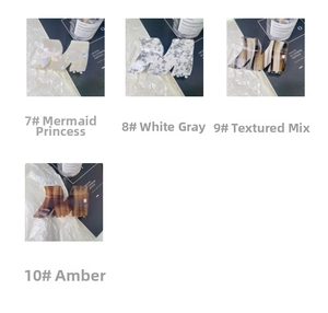 Detailed view of large acetate claw clips in iridescent, marble, and amber textures