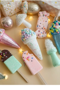 Festive dessert ornaments with glitter and beads arranged for Christmas tree decoration