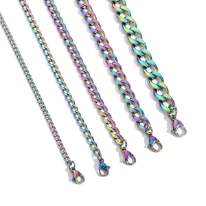 Macro shot of five rainbow-colored Cuban chain necklaces with lobster clasps in various widths
