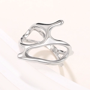 Macro view of liquid metal ring featuring irregular curves and high-gloss mirror finish