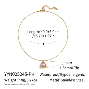 Detailed view of gold plated stainless steel chain necklace with pink zircon triangle pendant