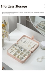 Pink portable faux leather jewelry organizer with slots for rings and necklaces