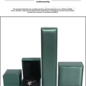 Deep green jewelry box set featuring necklace display and textured leather finish