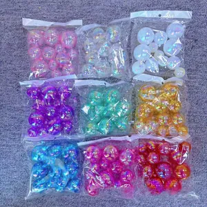 Close-up of assorted iridescent cake topper balls in various colors and sizes
