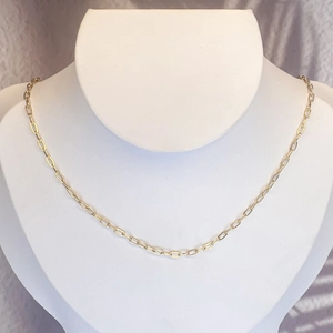 18K gold plated stainless steel paperclip chain necklace on a white display mannequin