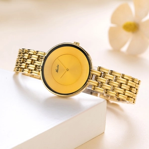 Elegant gold quartz watch with black dial and metal link strap for women stylish design