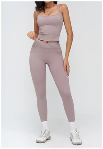 Detail view of high-waist yoga leggings with V-shaped waistband and side pockets