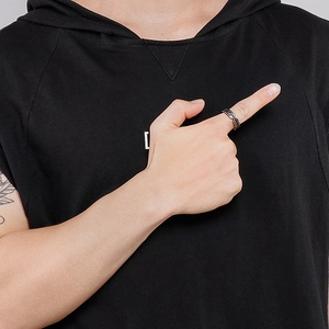 Detailed view of punk style stainless steel gear ring on finger for men