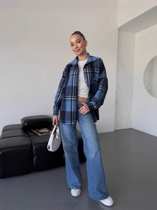 Casual blue plaid long sleeve shirt with white crop top and denim wide leg pants