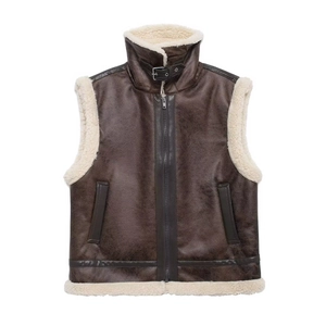 Detail of high collar vest with metal buckle and soft teddy faux shearling lining