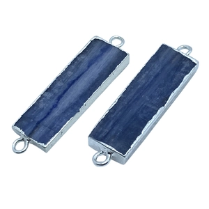 Macro detail of rectangular blue kyanite pendants with silver plated edges and dual loops