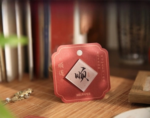 Detail view of Shunsui acrylic fridge magnet with elegant red pattern and calligraphy