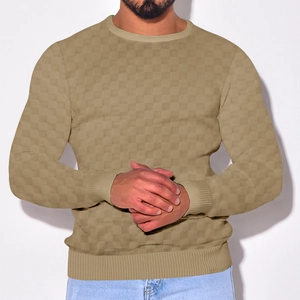 Detailed view of khaki knit texture and crew neckline on men's checkerboard sweater