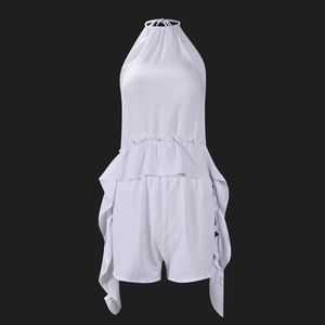 Detail of white cotton crinkle fabric halter top and shorts set with ruffle hem