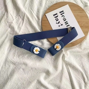 Close-up of adjustable elastic waist belt in navy blue with white daisy pattern
