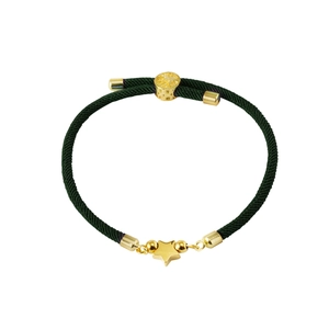 Detailed macro view of dark green braided rope bracelet with gold star charm and beads