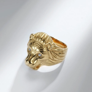 Golden titanium steel lion head ring with sparkling rhinestone eyes and matte finish