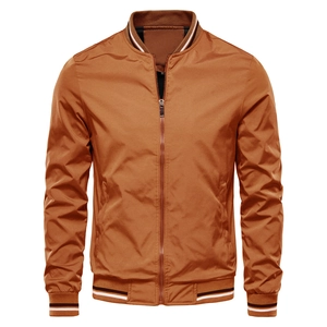 Detail of camel bomber jacket with striped ribbed collar and metal zipper closure