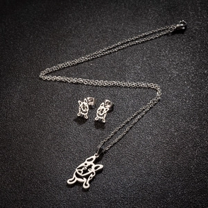 Silver stainless steel jewelry set featuring cute cartoon dog necklace and stud earrings