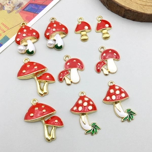 Cute mushroom alloy pendants with red enamel finish and faux pearl details for DIY