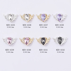 Winged heart nail art charms with drop-shaped crystals in gold and silver plating