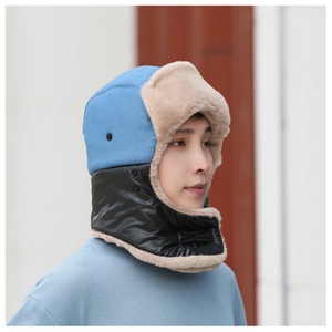 Detail view of the plush faux fur lining and windproof material on the winter trapper hat