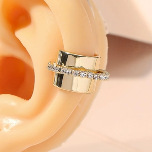 Elegant gold metal ear cuff with micro-pave crystals shown on ear for a modern look