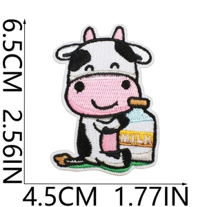 Close-up of cute cartoon cow embroidery patch showing 6.5cm height dimension details