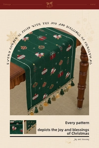 Detail of vintage Christmas table runner with green knit patterns and festive tassels